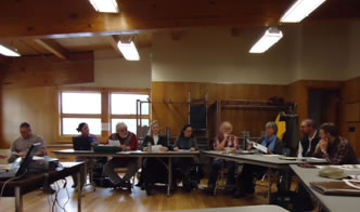 Kennebec Woodland Partnership quarterly meeting - people sitting around tables listening to the discussion.