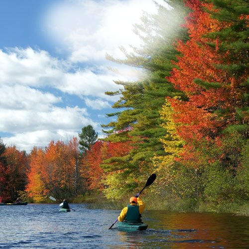 paddlers on androscoggin river in autumn