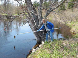 BPC staffer collects a water sample
