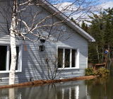 A house surrounded by flood water.