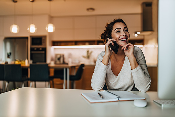 This is a graphic showing a person talking on a telephone.