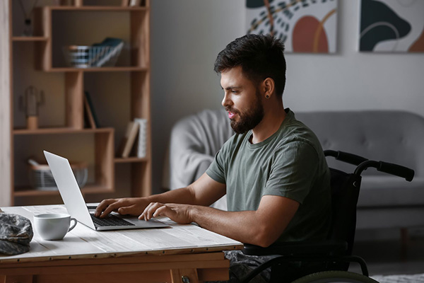 This is a graphic of a person working on a computer.